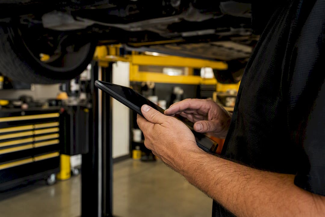 Technician preparing service documentation on tablet