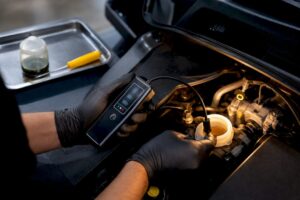 Technician testing brake fluid sample