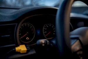 Flashing check engine warning light on dashboard