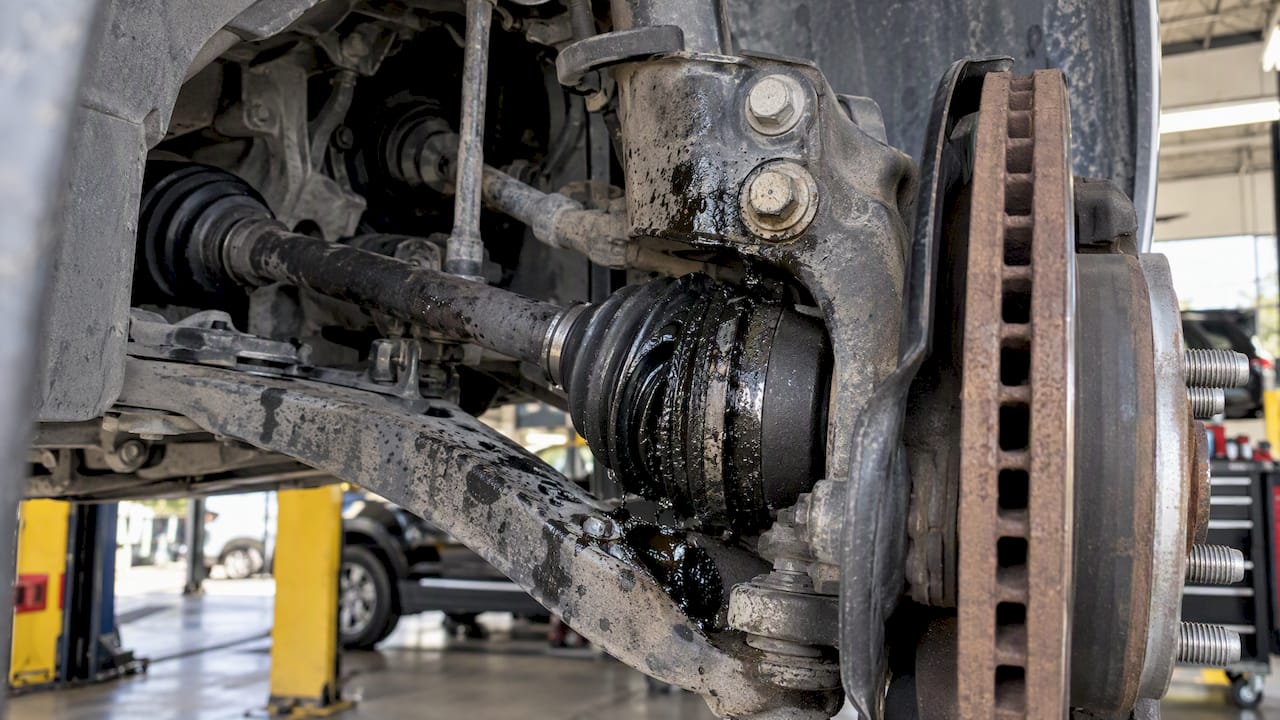 CV grease splattered inside a wheel well