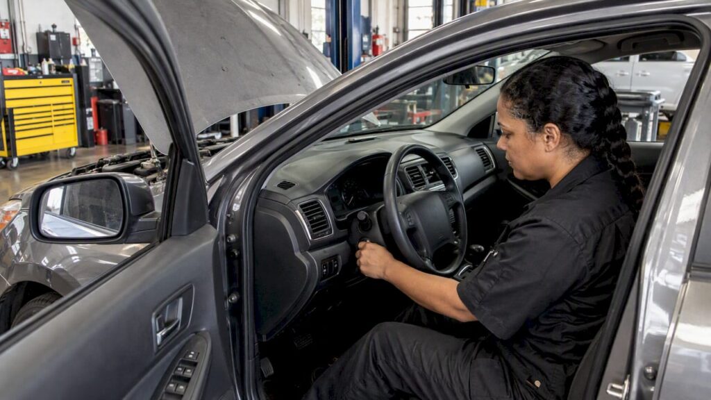 Technician checks a sedan after a no-crank start